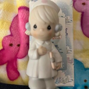Precious Moments Nurse Figurine with White and Pink Accents